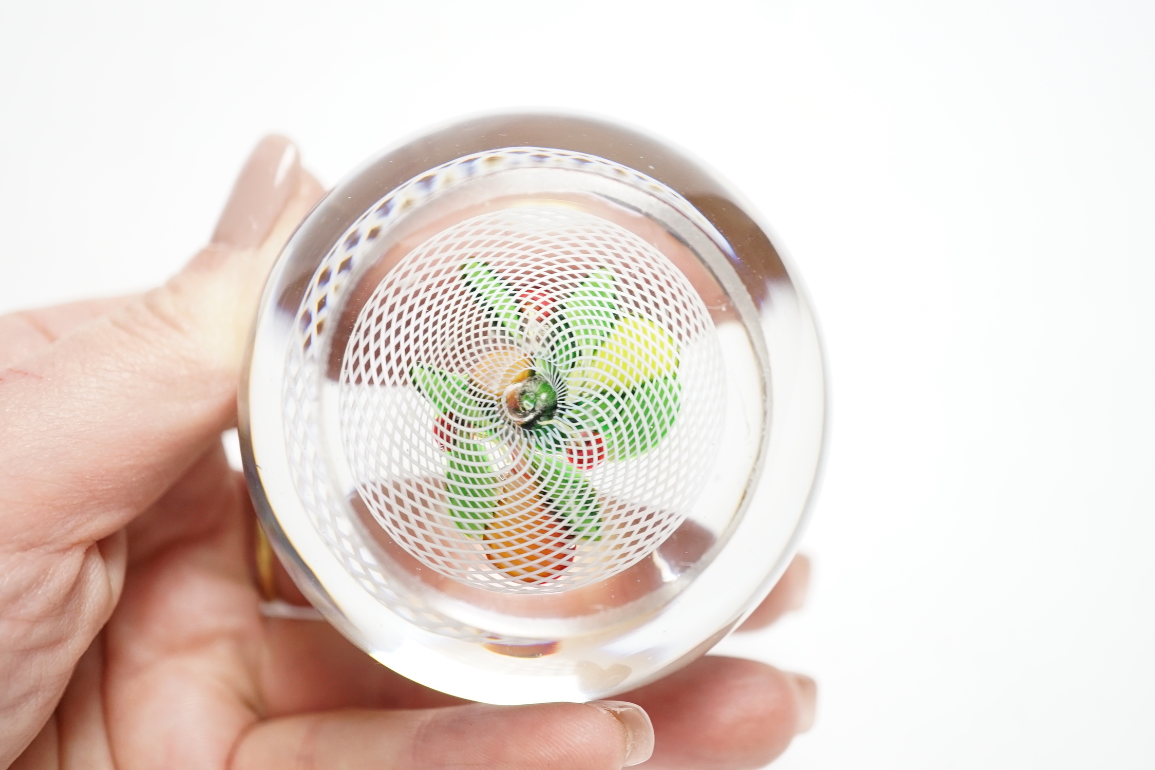 A St Louis fruit paperweight, on a latticino ground, 6.3cm